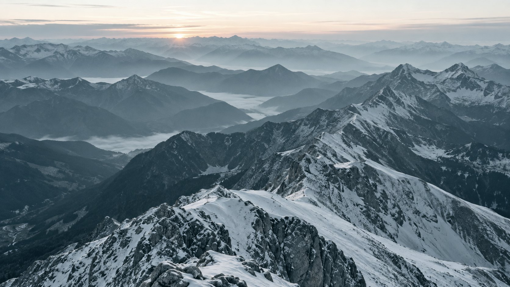 Layered mountain ridgelines at dawn